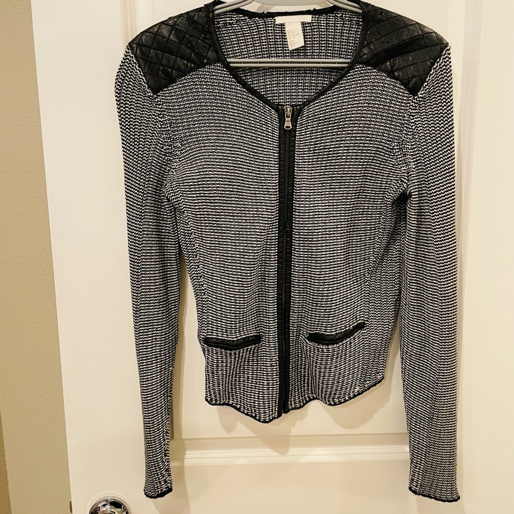 Black jacket with lightly worn faux leather shoulders